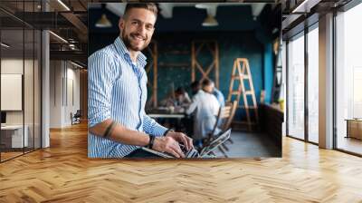 Man Working At Laptop In Contemporary Office Wall mural