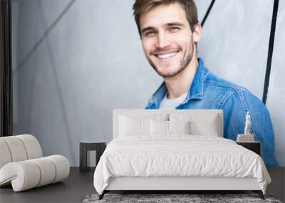 Perfect man. Portrait of happy fashionable handsome man in jeans shirt. Wall mural