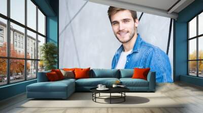 Perfect man. Portrait of happy fashionable handsome man in jeans shirt. Wall mural