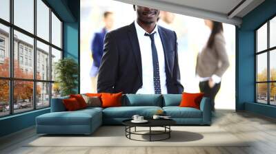 smiling african american business man with executives working Wall mural