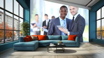 Two business men working together in the office Wall mural