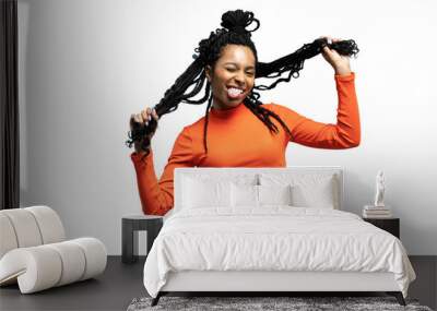 Young lovable woman with african hairstyle laughing during indoor photoshoot. Graceful cute girl in casual clothes enjoying leisure time in studio isolated on a transparent background Wall mural