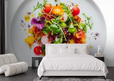 Colorful gourmet salad on a white plate featuring an assortment of fresh vegetables, vibrant edible flowers, and artistically scattered herbs, perfect for culinary enthusiasts Wall mural