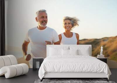 A retired couple running on the beach, healthy lifestyle jogging, happy run, mature Wall mural