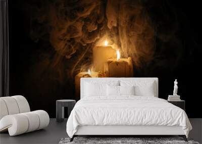 Lit candle flame through heavy smoke fog mist vapour flow twist beautiful mistic Wall mural