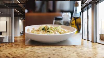 alfredo spaghetti broccoli chicken white sauce in restaurant background Wall mural