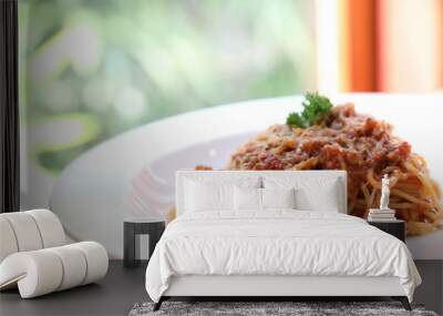 spaghetti Bolognese with minced beef and tomato sauce garnished with parmesan cheese and basil , Italian food Wall mural