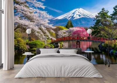 A serene Japanese garden with cherry blossom trees in full bloom. Wall mural