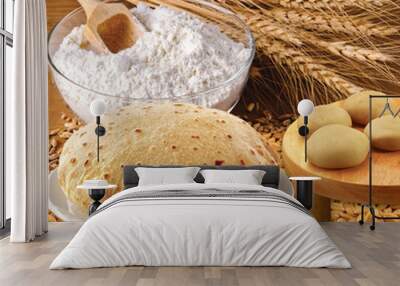 Rustic shot of a plate of chapati surrounded by ingredients Wall mural