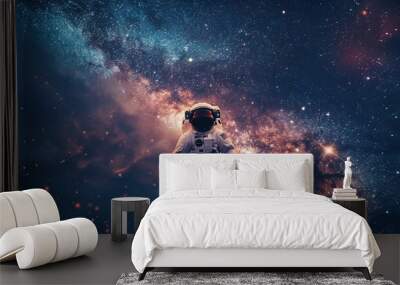 A lone astronaut floating before the vast open universe Wall mural