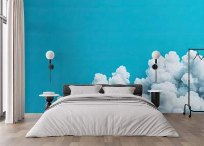 A vibrant blue sky with fluffy white clouds, perfect for conveying tranquility and serenity in any visual project. Wall mural