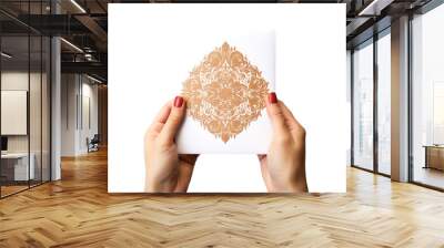 Close-up of a hand holding a beautifully decorated greeting card isolated on white background Wall mural