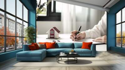 agents working in real estate investment and home insurance signing contracts in accordance with the home buying insurance agreements approving purchases for clients Wall mural