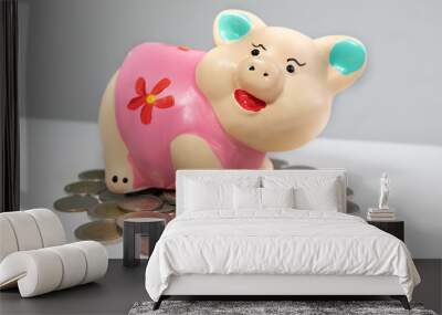 pink piggy bank saving money and coins pile Wall mural