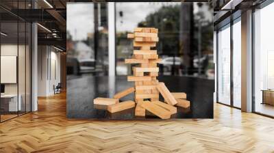 Wood block pile with architecture model with classic black tone background, Concept Risk management and strategy plan, growth business success process and team work Wall mural