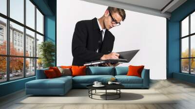 young man in classic black suit with laptop and papers office and  business concept  Wall mural