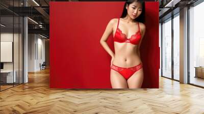 Sexy asian woman in red sexy lingerie on red studio background. Generative AI Wall mural