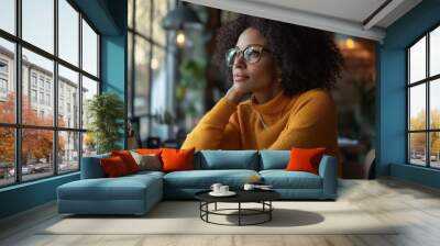 A businesswoman embracing change at her desk, reviewing new strategies with an open-minded and adaptable attitude towards business transformation. Wall mural