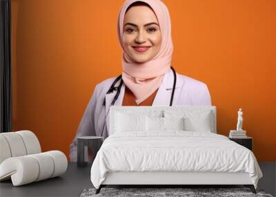 Confident professional female doctor Muslim national nursing profession on orange background Wall mural