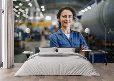 young female worker in airplane hangar Wall mural