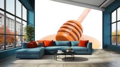 Honey dripping from wooden dipper Wall mural