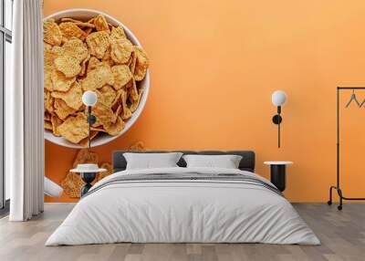 A bowl of cereal with milk on an orange background. Space for text. Breakfast food concept. Wall mural