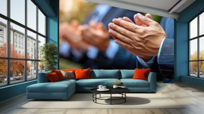 Close up of hands clasped in prayer, a symbol of faith, hope, and spiritual connection. Wall mural