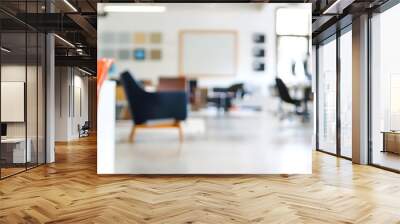 Modern office space with red chairs in the foreground and desks with office workers in the background. Wall mural