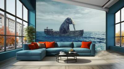 Elephant in a boat at sea. Wall mural