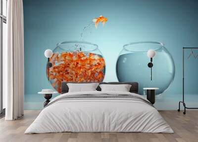 I'm not like others - be different concept - goldfish jumping in a bigger fish bowl. Wall mural