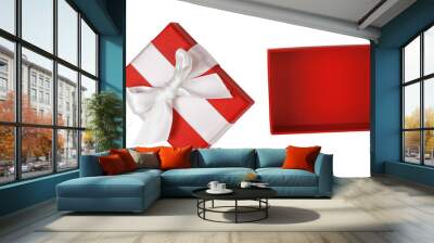 Open empty red gift box with white satin ribbon bow isolated on white background Wall mural