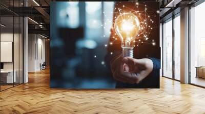 Businessman hand holding creative light bulb with industry network, analysis solution and development marketing network icons planning strategy, Modern business, Innovative of new ideas Wall mural