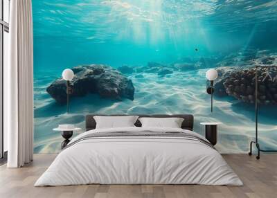 The tropical blue ocean of Hawaii is showcased with white sand and underwater stones, creating a serene ocean background Wall mural