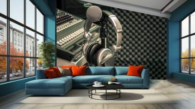 Close up instruments music background concept.Headphones hang  on microphone with sound mixer board in home recording studio.Free space for creative design text & wording mock up template wallpaper. Wall mural