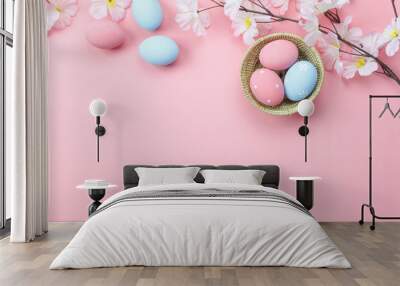 Table top view shot of arrangement decoration Happy Easter holiday background concept.Flat lay colorful bunny eggs with spring floral on modern beautiful pink paper at office desk.Design pastel tone. Wall mural