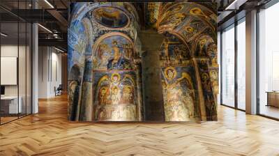 Frescoes on a wall of cave church in Goreme, Cappadocia, Turkey. Wall mural