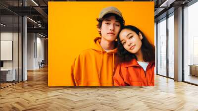 asian teenagers couple wearing orange clothes Wall mural