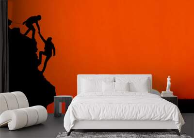 silhouette of helping hand between two climber Wall mural