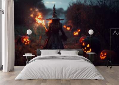 A witch at night with a blazing torch and a pointed hat. She is walking down a path of glowing Halloween pumpkin jack o lanterns. Spooky nighttime scary magic spell photo. Wall mural