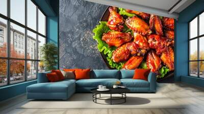 spicey chicken wings with lettuce on plate. copy space Wall mural