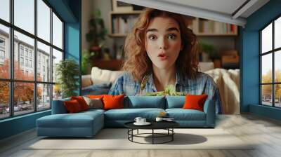 photo of a women sitting in the living room eating salad Wall mural