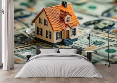 Miniature House Sitting on a Pile of US Dollar Bills Wall mural