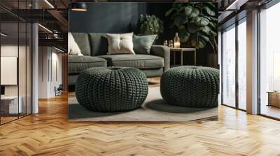 Two knitted poufs near dark blue corner sofa. Scandinavian home interior design of modern living room.
 Wall mural