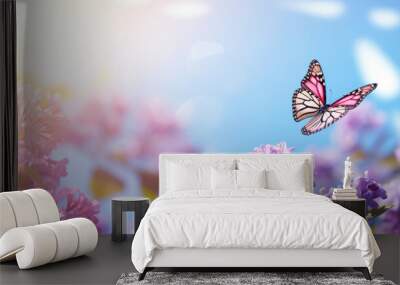 Floral spring natural blue background with fluffy airy lilac flowers on meadow and fluttering butterflies on blue sky background. Wall mural