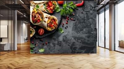 Burrito Mexican food. Burritos wraps with beef and vegetables on black stone background. Wall mural