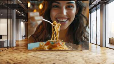 Close-up of happy woman eating pasta for dinner in cafe. Wall mural