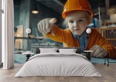 Portrait of child civil engineer inspecting a construction model, pointing to details, in an office with blueprints. Wall mural