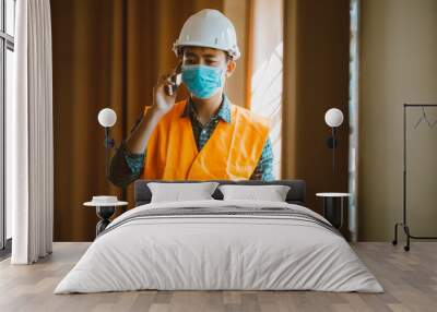 Portrait of industrial engineer man wears protective mask in office for prevention COVID-19 virus to stop spreading. Wall mural