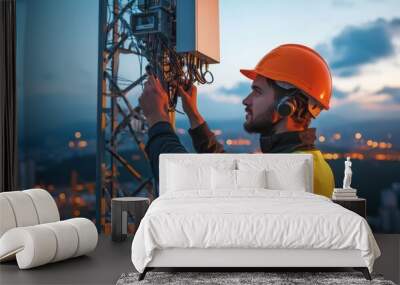 Telecommunications technician working on a communication tower, ensuring proper installation and maintenance of equipment outdoors. Wall mural