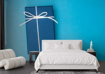 closeup gift box blue background top view Wall mural